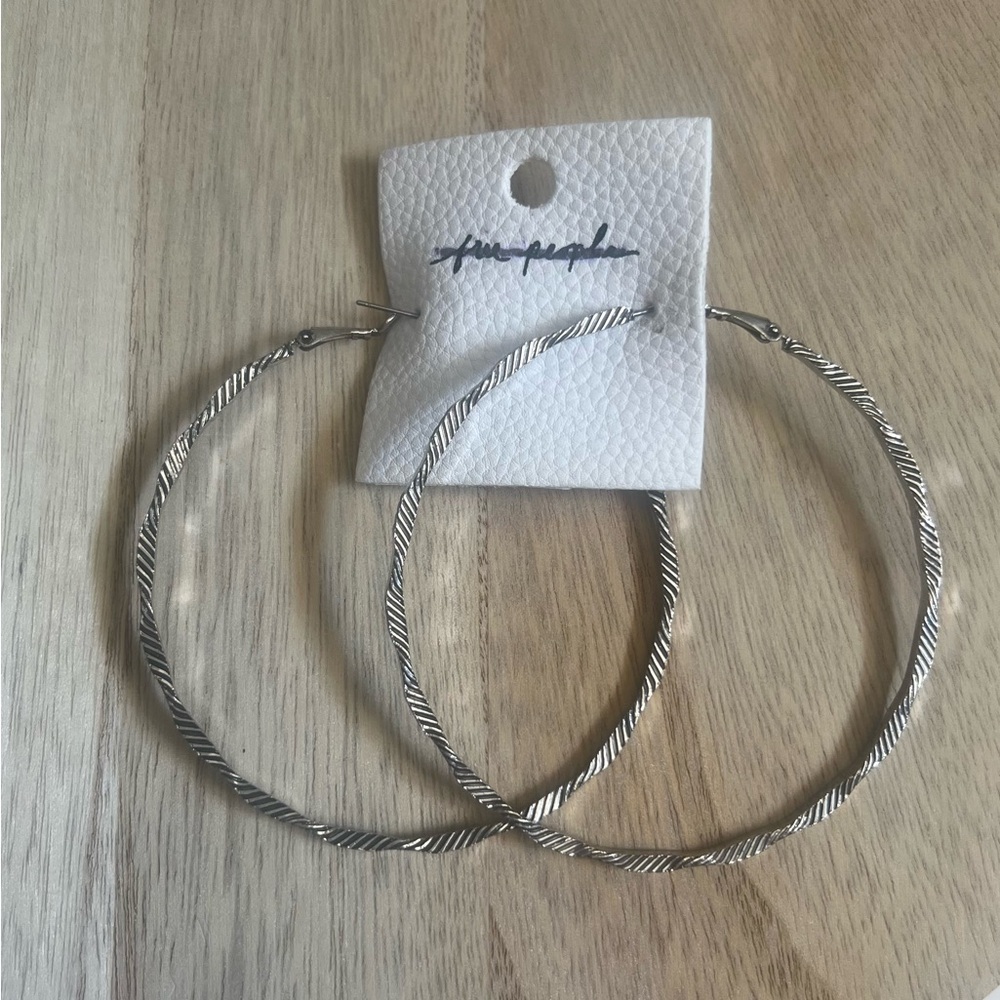 NEW Free People Silver Twisted Hoop Earrings✨ - Picture 3 of 7